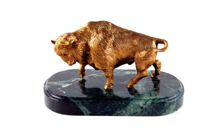 Bronze statuette on natural stone Bison